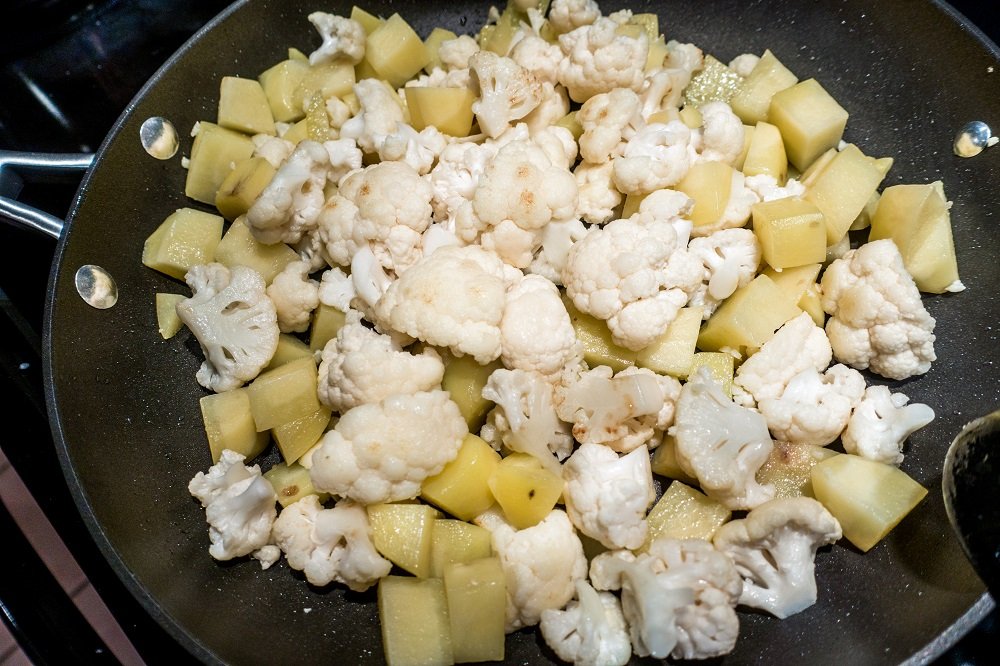 Saute the cauliflower and potato for the alu gobi