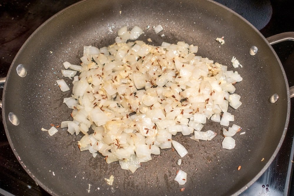 Cook the onion until translucent and add ginger and garlic