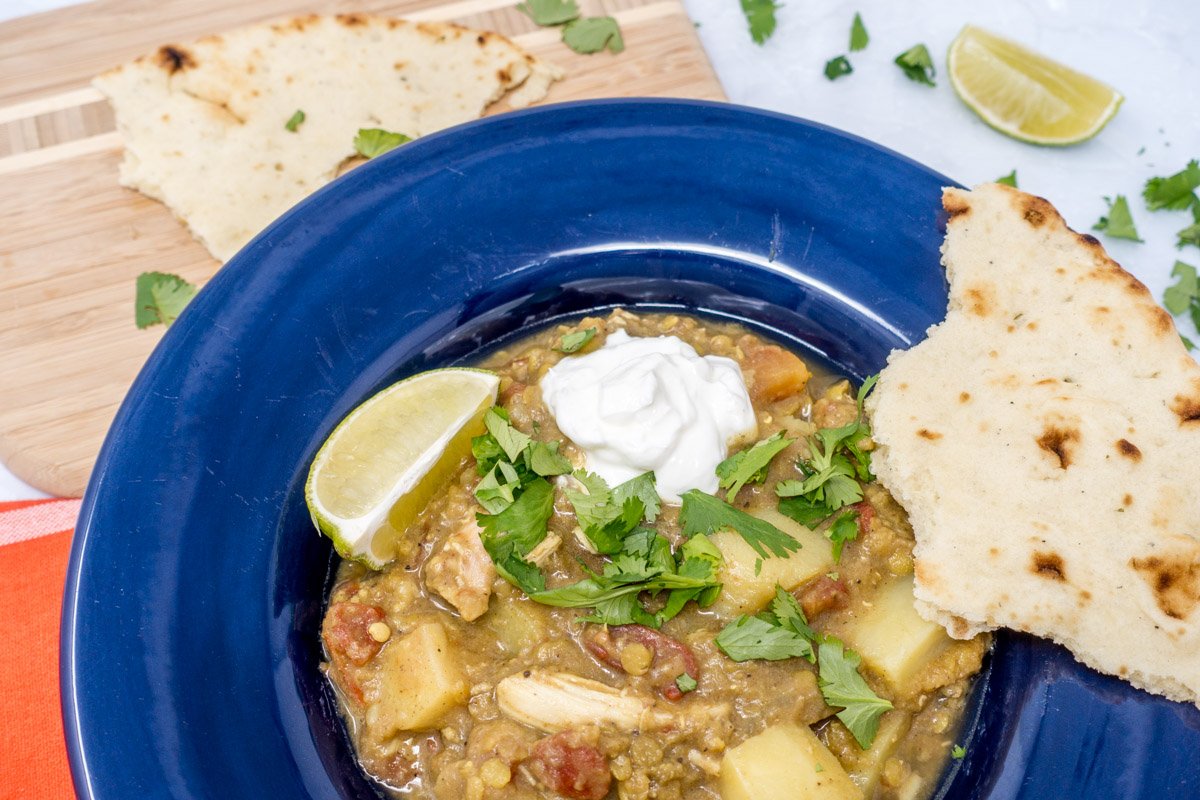 This slow cooker curried chicken and lentils with potatoes and tomatoes is the perfect, easy Indian comfort food dish