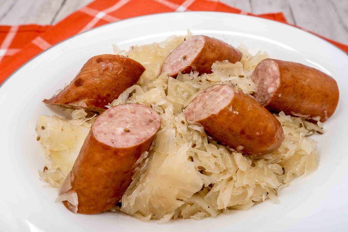 Kielbasa sauerkraut and potatoes in dish on table
