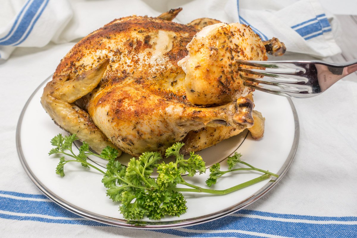 For a delicious dinner with minimal effort, try making this rotisserie chicken in a slow cooker at home.