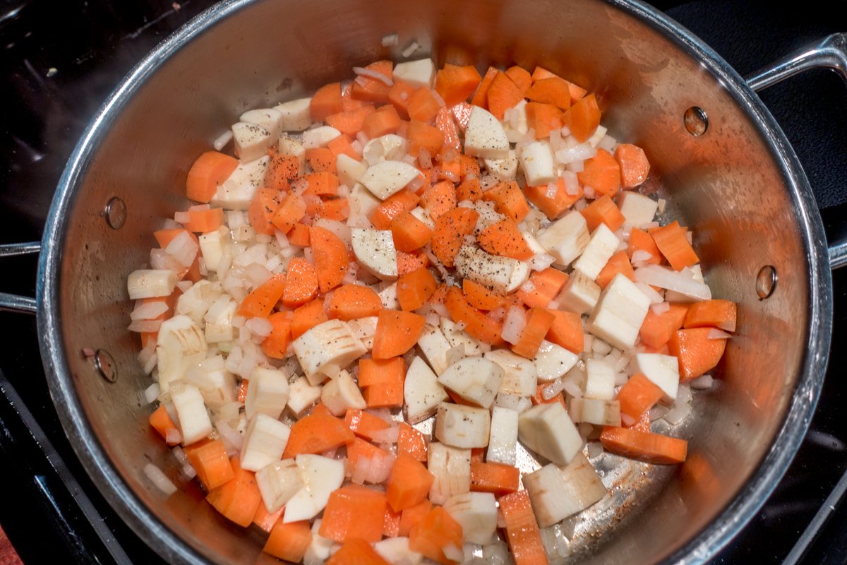 Start your shepherd's pie by sauteeing the carrots, onion, and parsnips