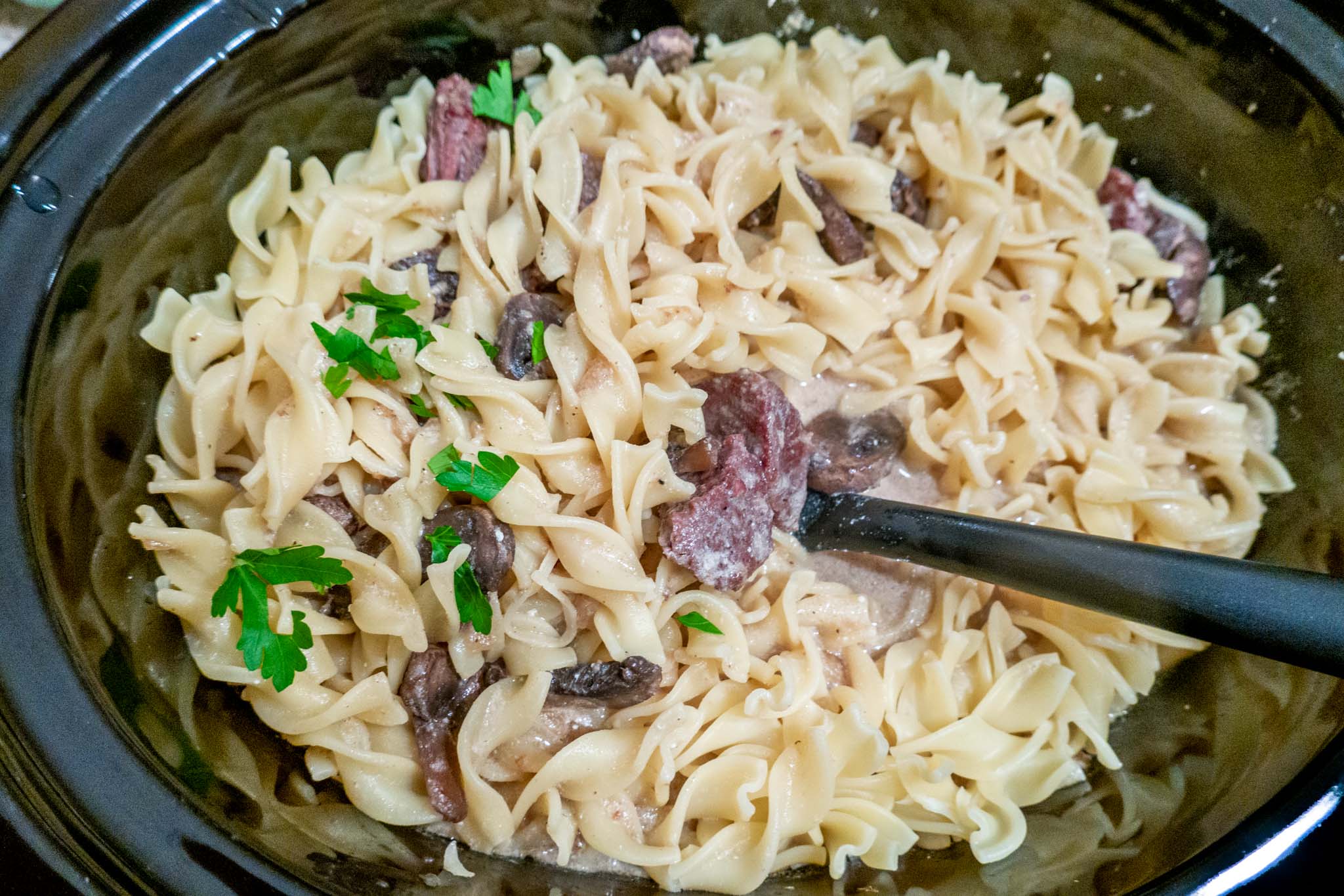 Easy crockpot beef stroganoff combined with egg noodles