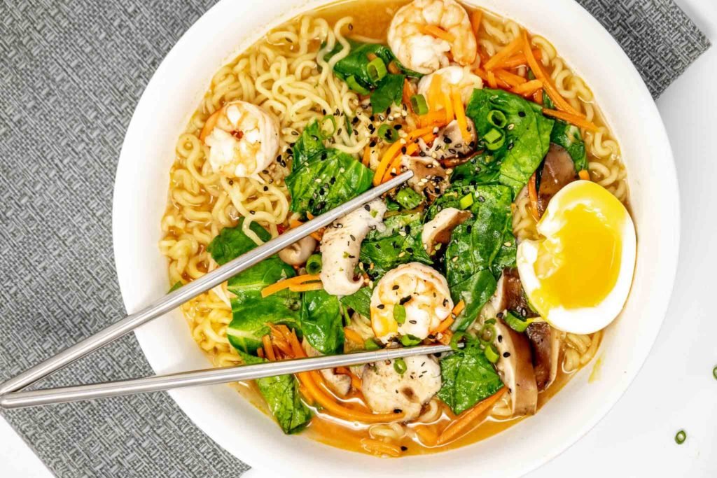Bowl of spicy ramen with shrimp and egg