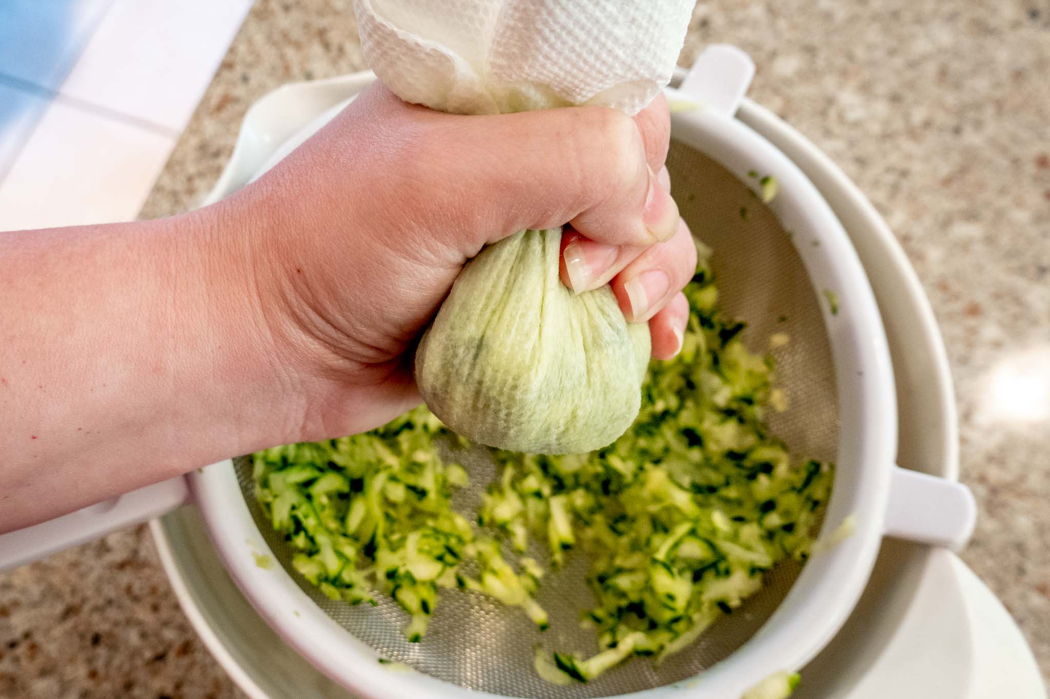 Squeezing liquid from zucchini using a paper towel
