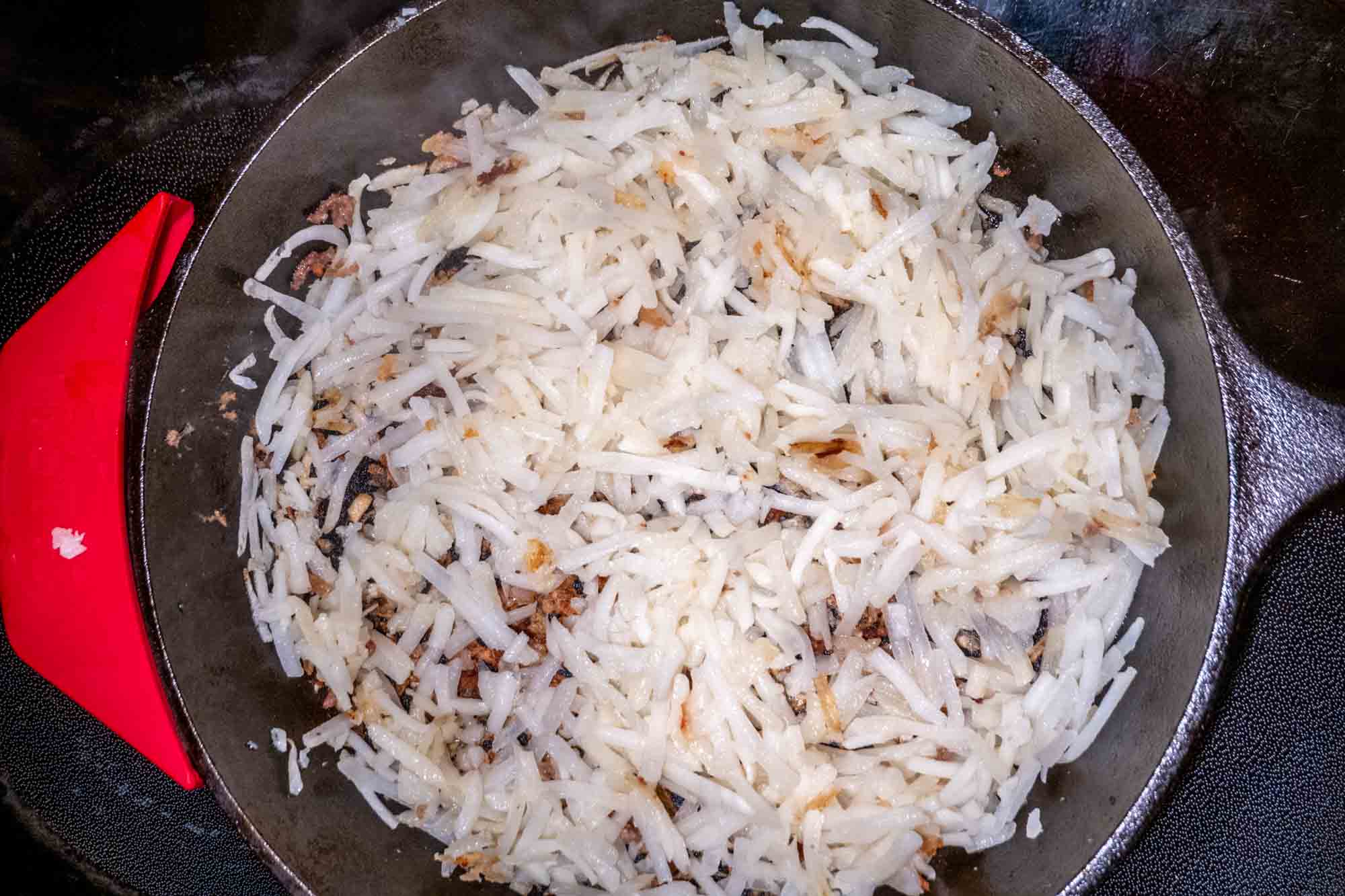 Hash browns in a skillet.