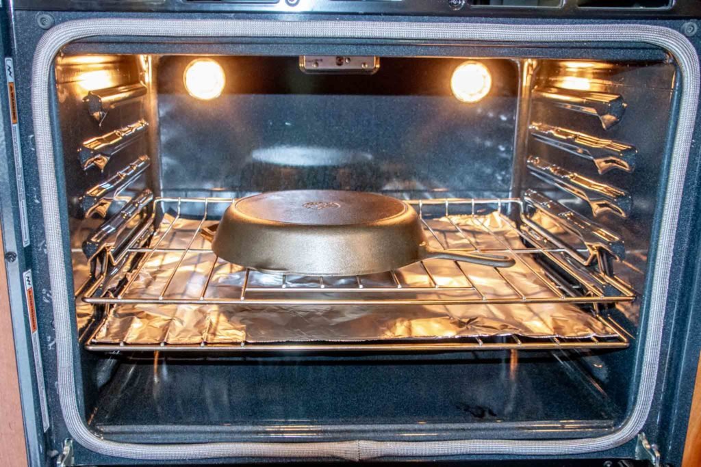 Pan in an oven over a sheet of foil